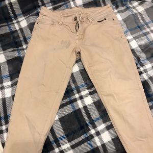 Beige jeans stained